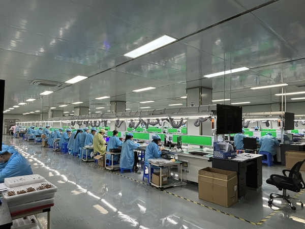 A clean and organized assembly line in a Bluetooth earbuds factory